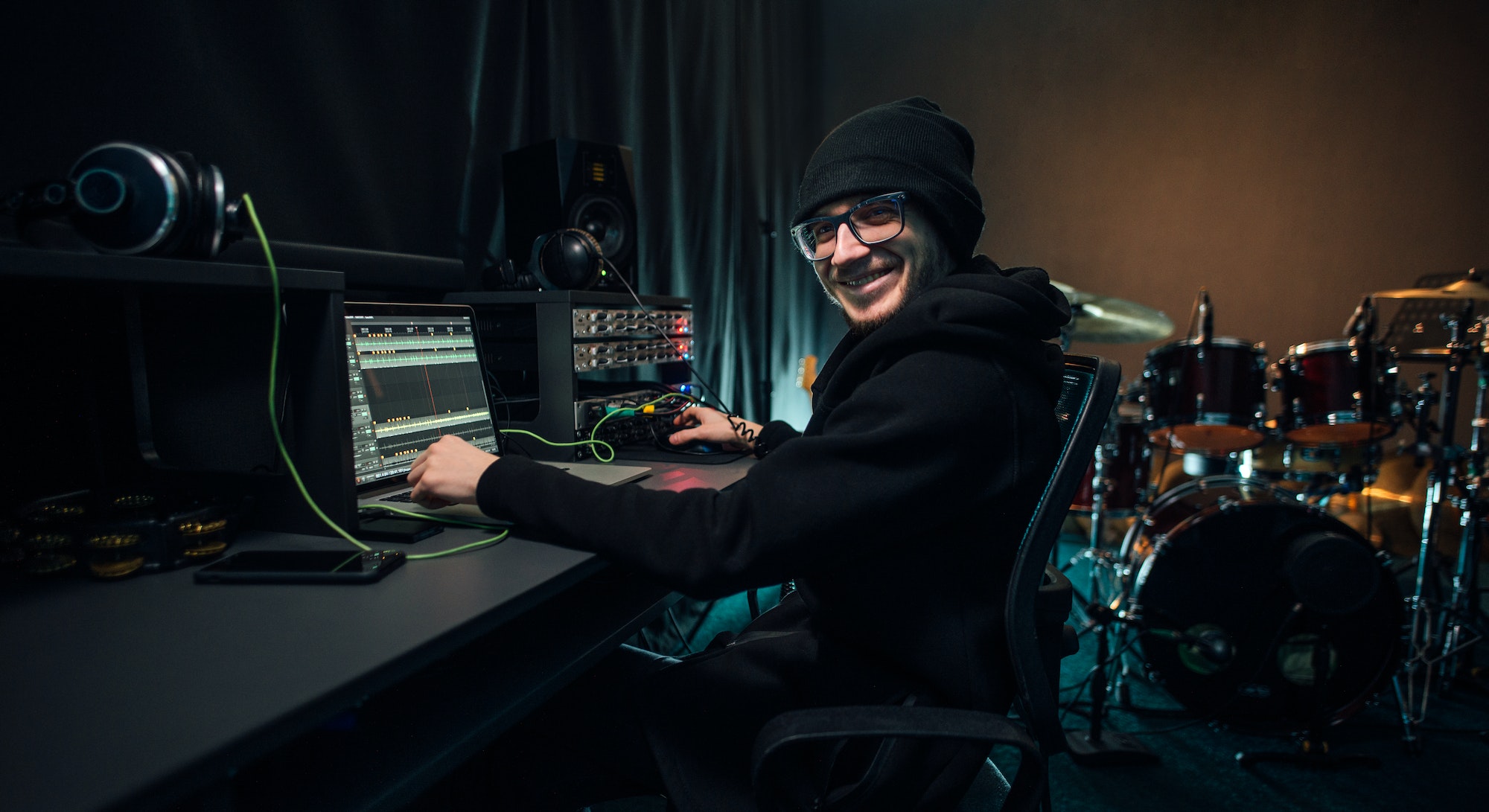 a-sound-engineer-uses-a-mixing-board-and-software-to-create-audio-track-.jpg a-sound-engineer-uses-a-mixing-board-and-software-to-create-audio-track-.jpg